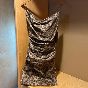 Nicole Miller, 8, gathered party dress in animal print with sheen.